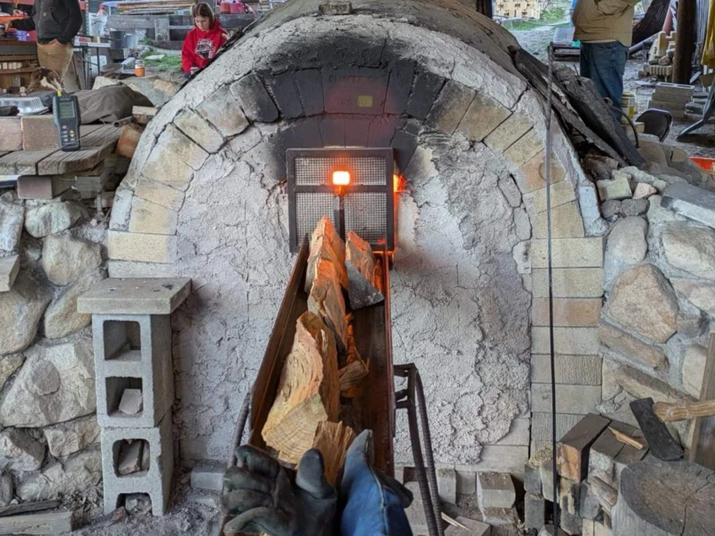 Loading wood into a firing kiln