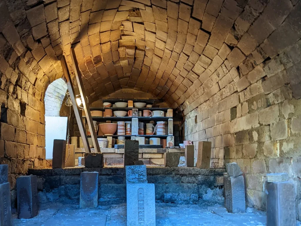 Stacked pottery inside a brick kiln
