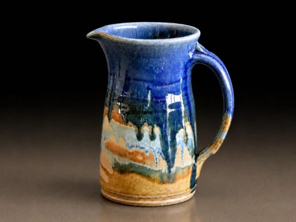 Blue glaze drip and tan matte pitcher