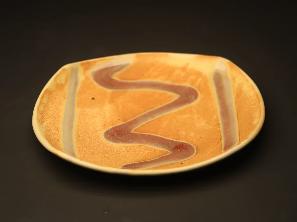 Orange sand and red squiggle platter